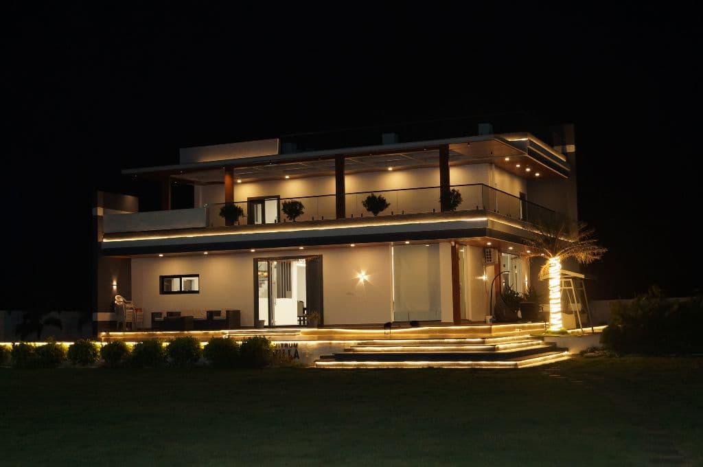 The farmhouse at night at Zen Anvisa Retreat, Kanakamamidi, Moinabad