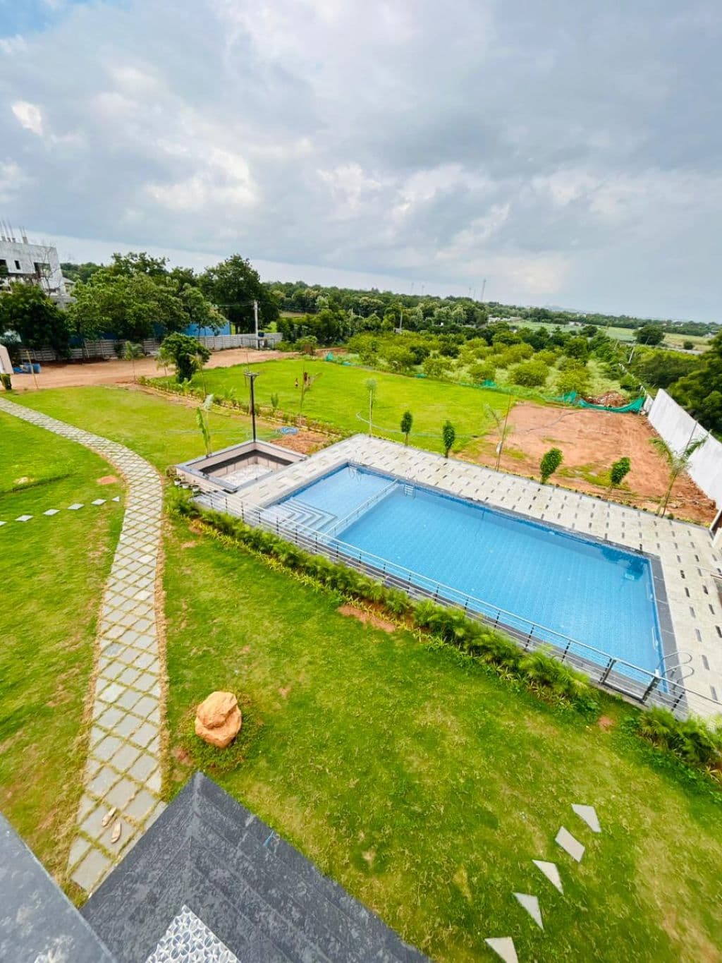 Aerial view of the farmhouse at Brown Farm Retreat, Bakaram, Moinabad