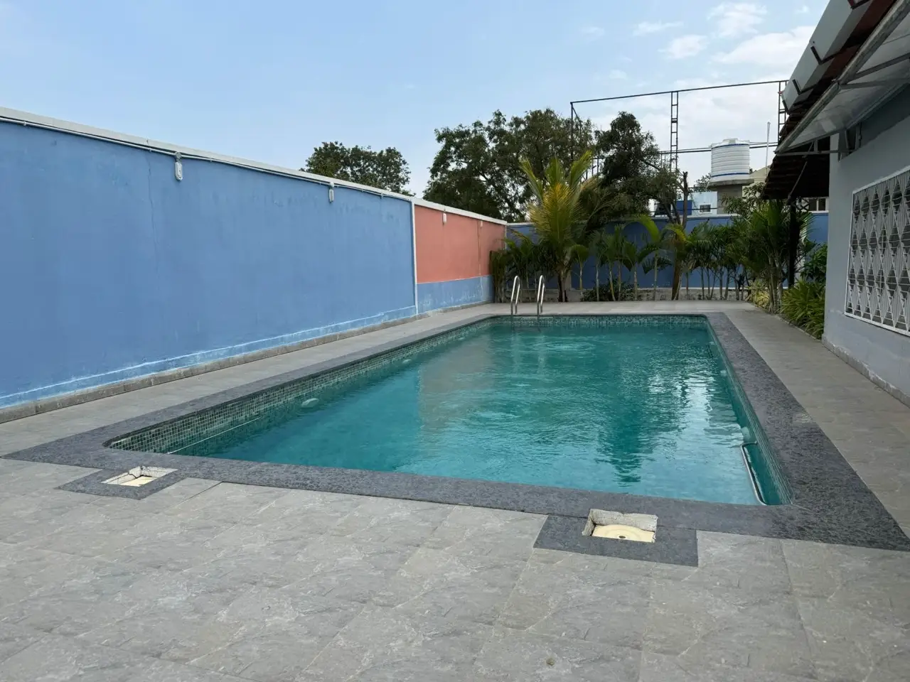Private swimming pool at Sunny Cliff Farmhouse, Nazeeb Nagar, Moinabad
